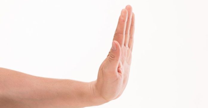 Hand gesture concept. Representation of man's palm. Man trying to stop different frauds among his collegues.